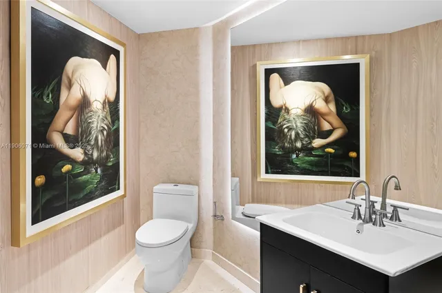 a bathroom with a toilet sink and tub