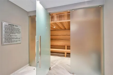 a bathroom with a bathtub and shower