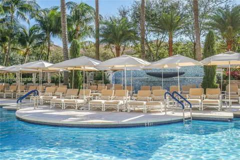a view of swimming pool with a yard and seating area