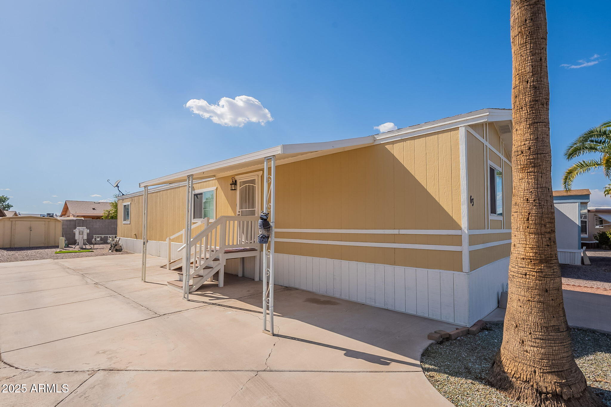 15606 South Gilbert Road, Unit 63 Chandler, AZ 85225 - Photo 2 of 21 a view of a house with a patio