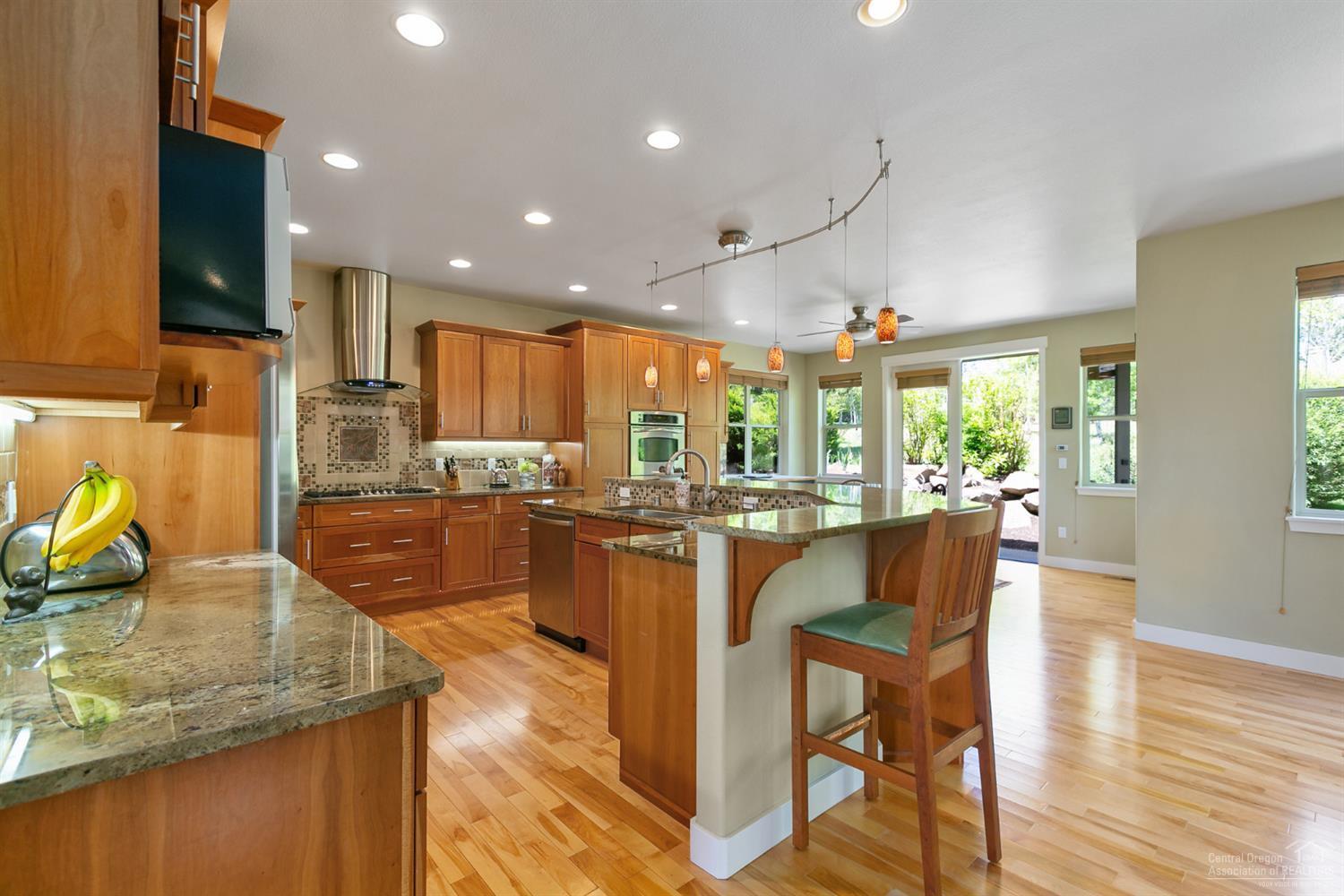 61950 Fall Creek Loop Bend, OR 97702 - Photo 4 of 25 Updated gourmet kitchen with beautiful C