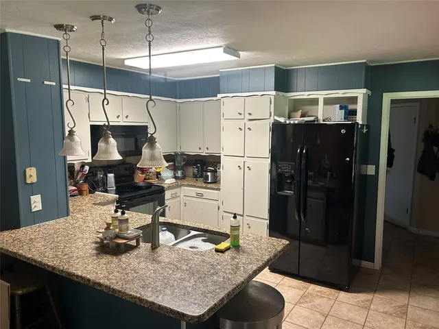 a bathroom with a sink a mirror and shower