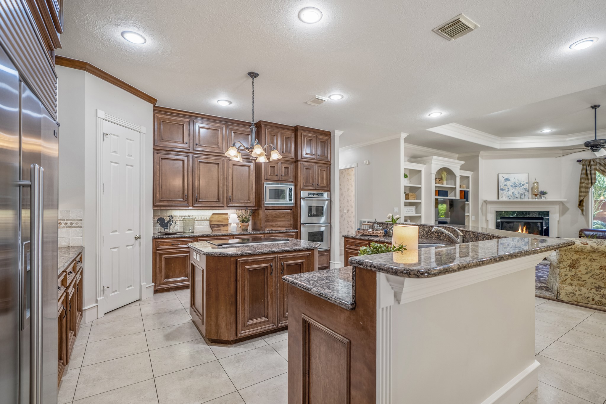 8806 Sterling Gate Circle Spring, TX 77379 - Photo 12 of 40 Expansive kitchen with granite breakfast bar and large walk in pantry.