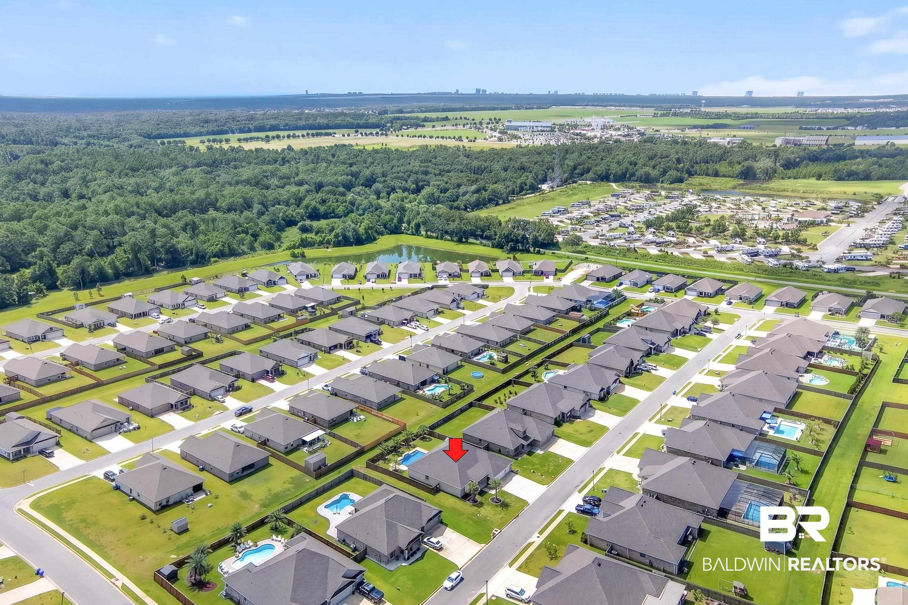 1724 Partridge Street Foley, AL 36535 - Photo 61 of 62 Aerial overview of a residential community featuring numerous single-family homes with gray roofs and green lawns