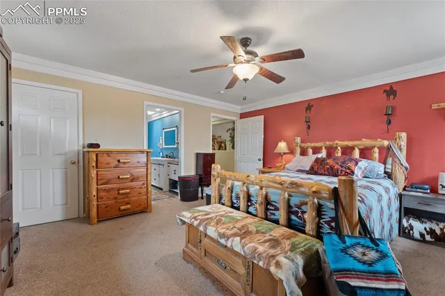 a living room with furniture and a baby crib