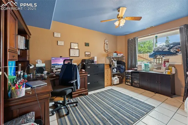 a living room with furniture a piano and a flat screen tv