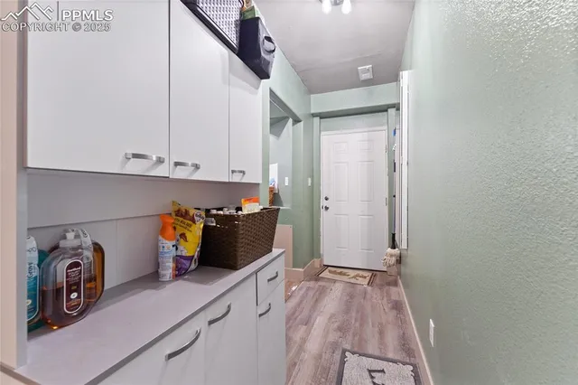 a utility room with sink dryer and washer