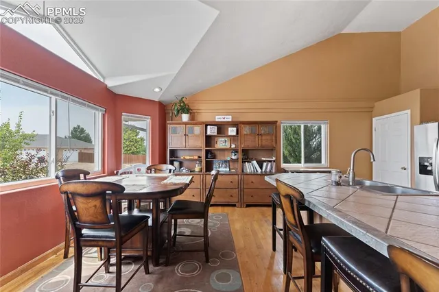 a view of a dining room with furniture window and outside view