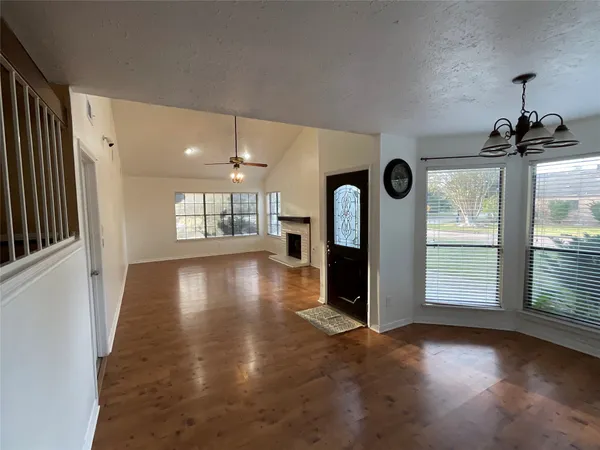 a view of livingroom with hardwood floor and a ceiling fan