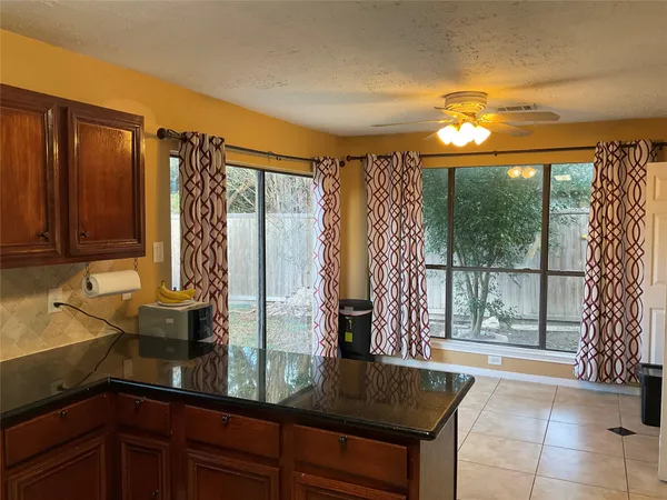 a kitchen with a large window and sink