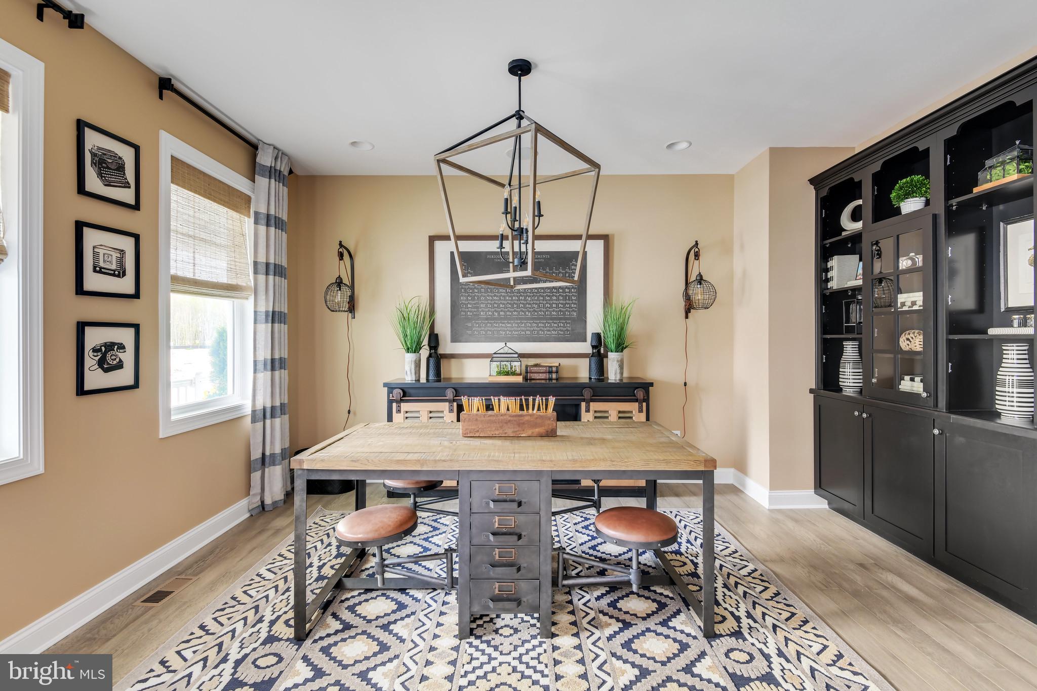 21797 Eastbridge Loop Lewes, DE 19958 - Photo 15 of 32 a view of a dining room with furniture and wooden floor