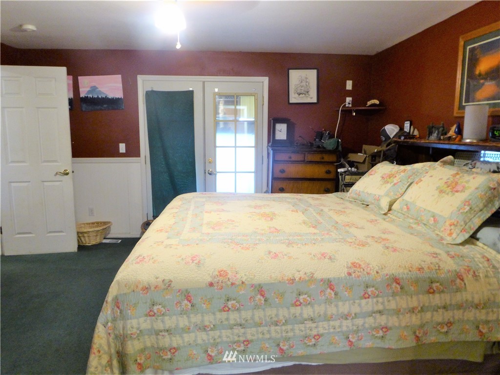 8209 177th Lane Southwest Rochester, WA 98579 - Photo 12 of 39 a large white bed in a white room