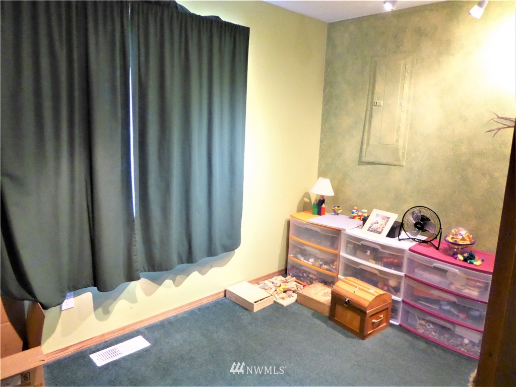 8209 177th Lane Southwest Rochester, WA 98579 - Photo 20 of 39 a room with toys and storage
