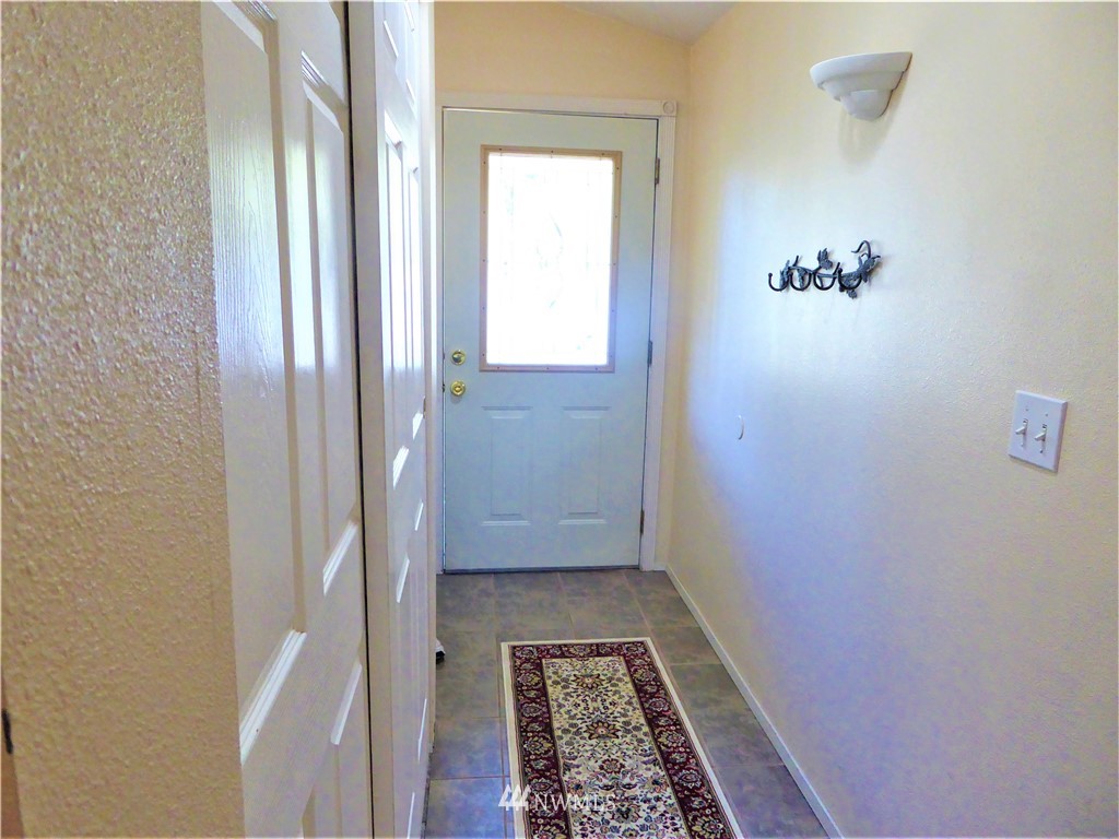 8209 177th Lane Southwest Rochester, WA 98579 - Photo 3 of 39 a view of hallway with a white walls