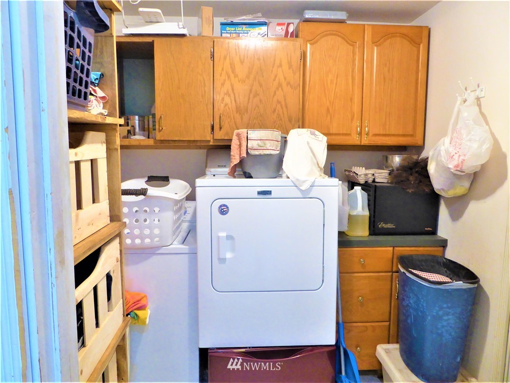 8209 177th Lane Southwest Rochester, WA 98579 - Photo 21 of 39 a utility room with dryer and washer