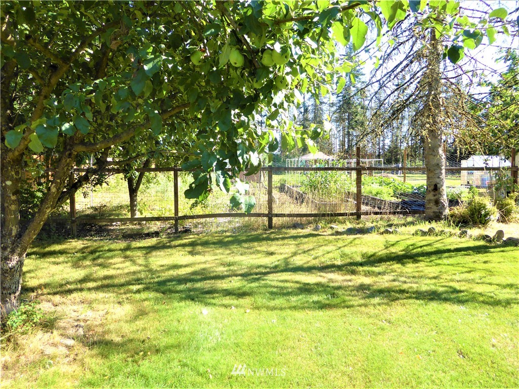 8209 177th Lane Southwest Rochester, WA 98579 - Photo 29 of 39 a view of swimming pool with an outdoor space and seating area