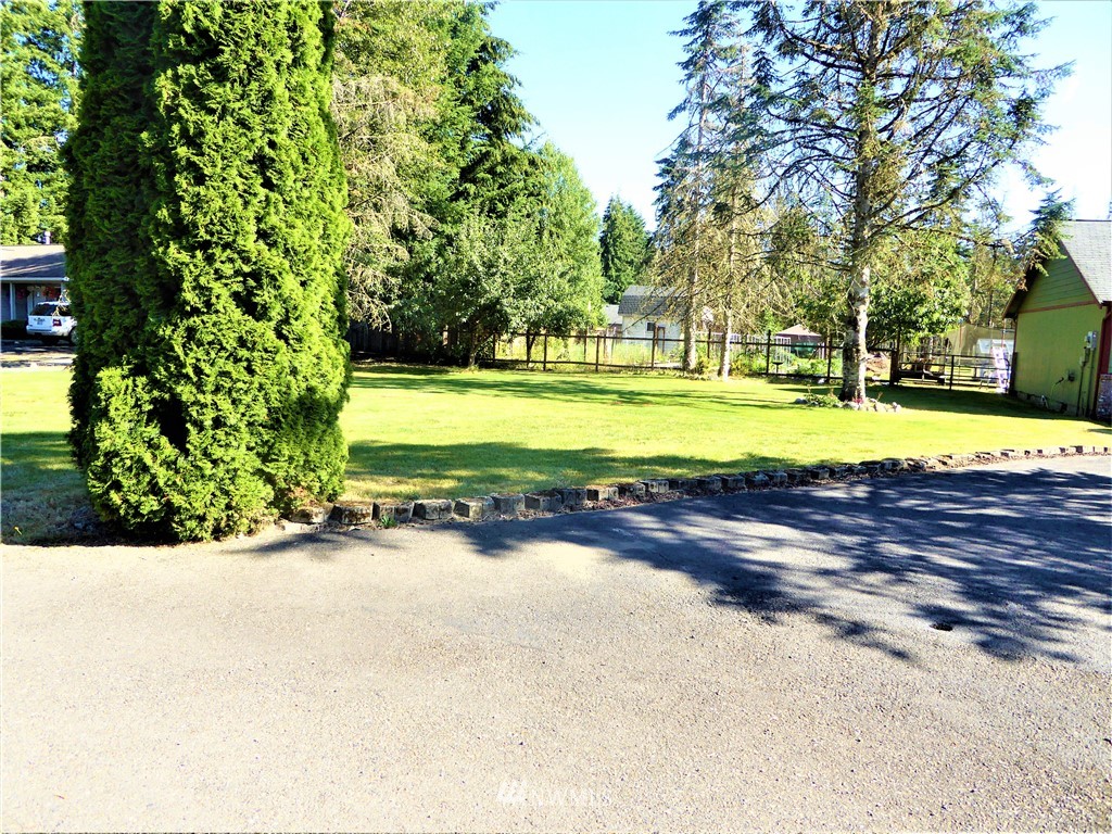 8209 177th Lane Southwest Rochester, WA 98579 - Photo 31 of 39 a view of a swimming pool and a yard