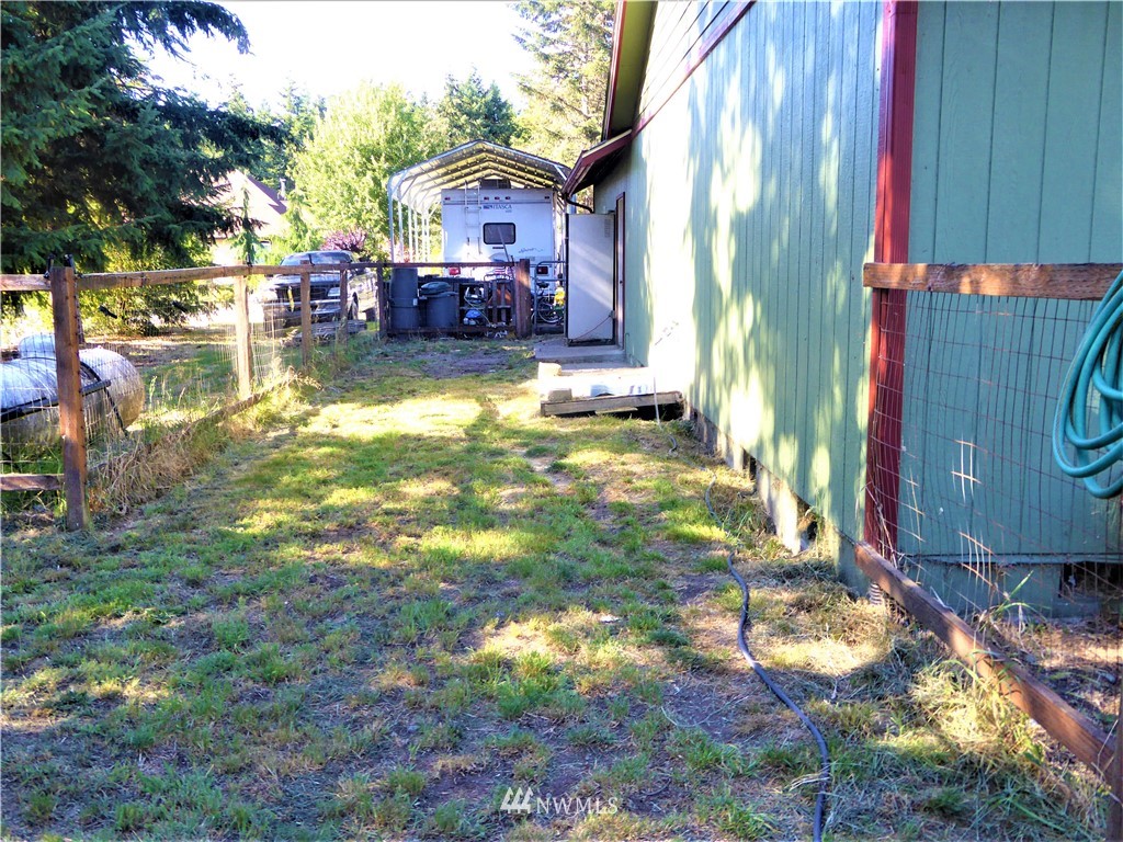 8209 177th Lane Southwest Rochester, WA 98579 - Photo 39 of 39 a view of a house with a yard