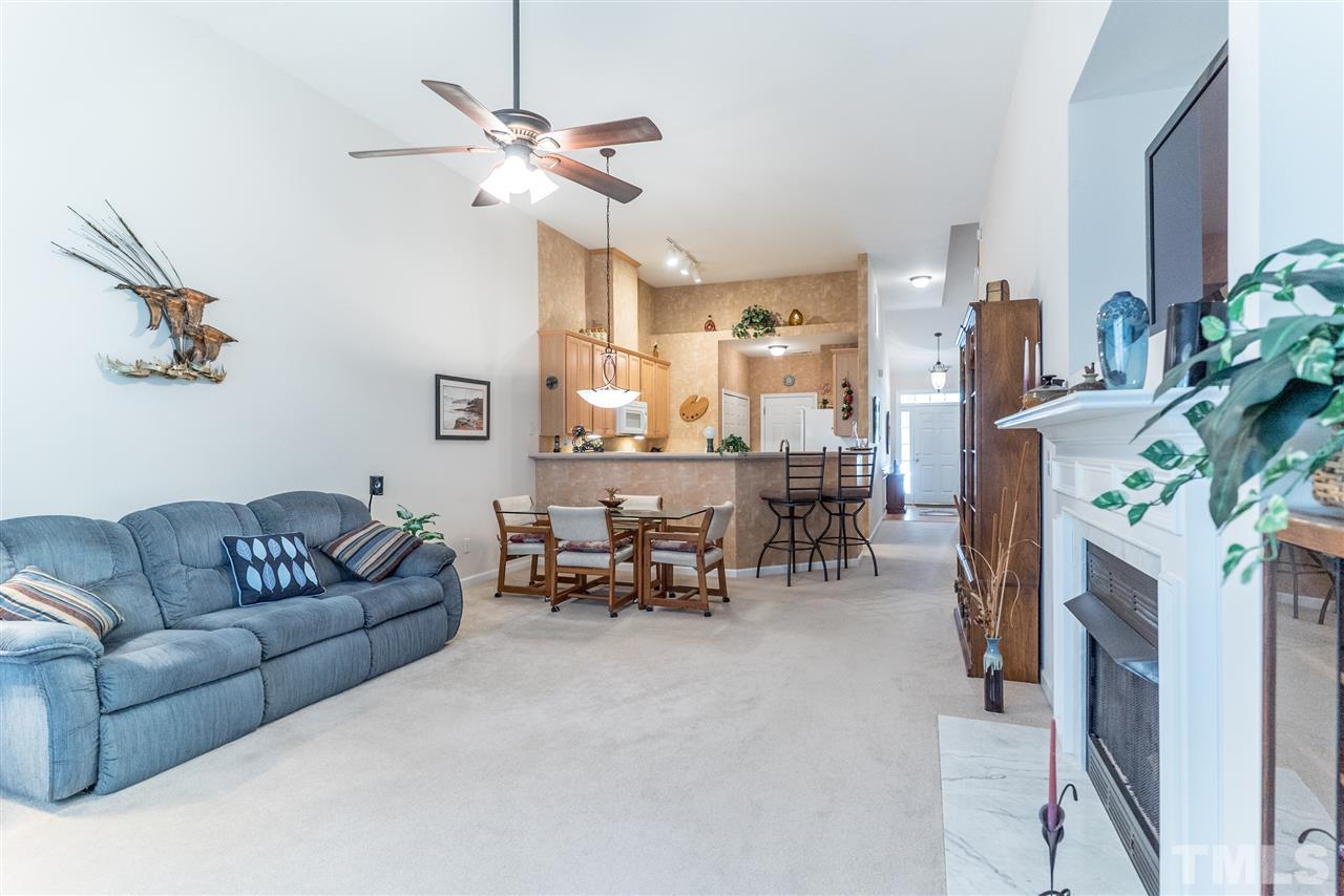 10423 Dapping Drive Raleigh, NC 27614 - Photo 11 of 25 a living room with furniture and a chandelier