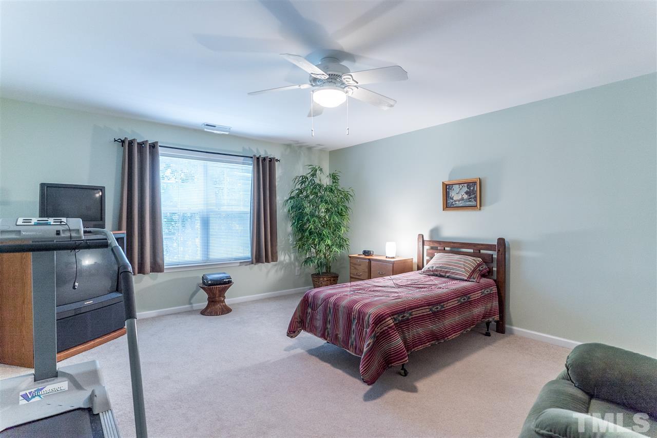 10423 Dapping Drive Raleigh, NC 27614 - Photo 17 of 25 a bedroom with a bed and ceiling fan