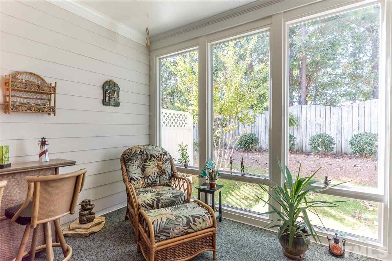 10423 Dapping Drive Raleigh, NC 27614 - Photo 20 of 25 a living room with furniture and a floor to ceiling window