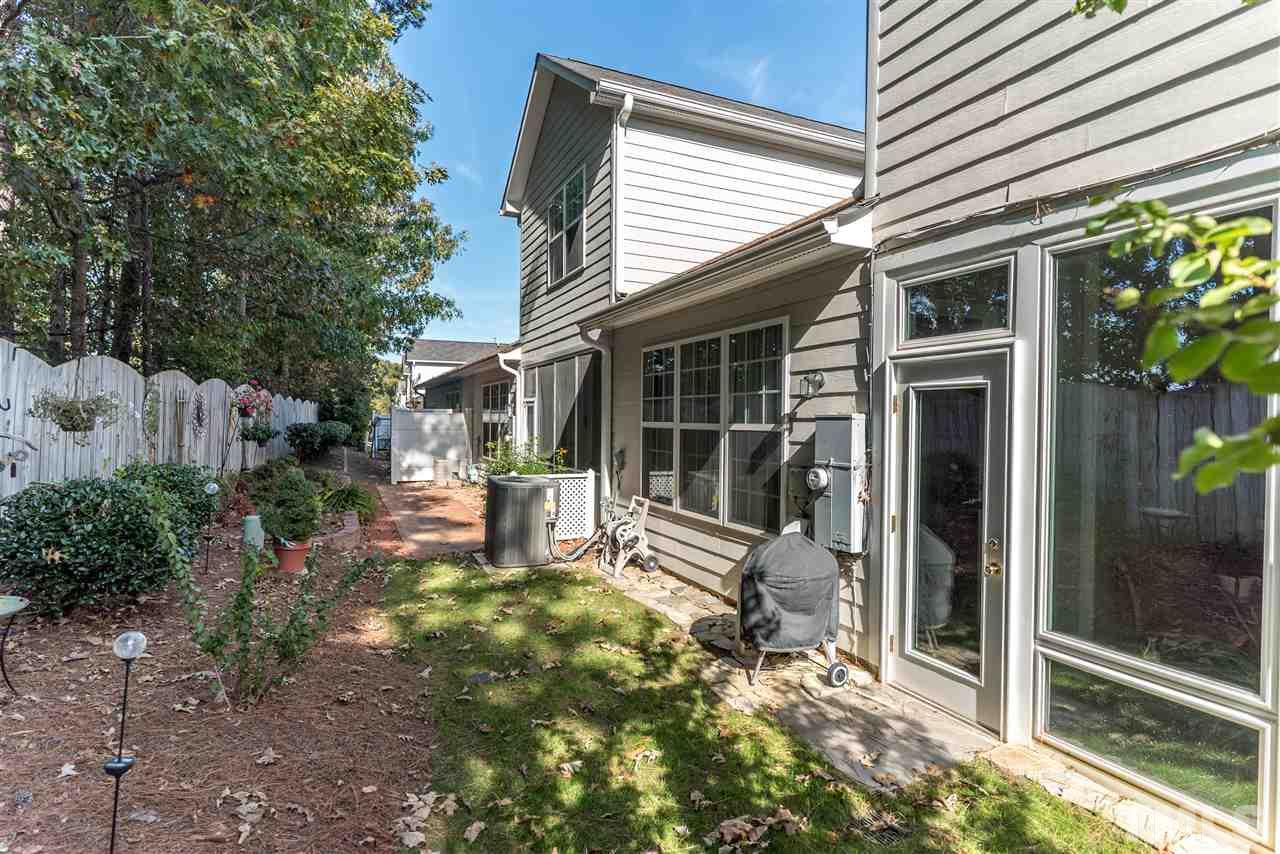 10423 Dapping Drive Raleigh, NC 27614 - Photo 22 of 25 a view of house with backyard outdoor seating and floor to ceiling window