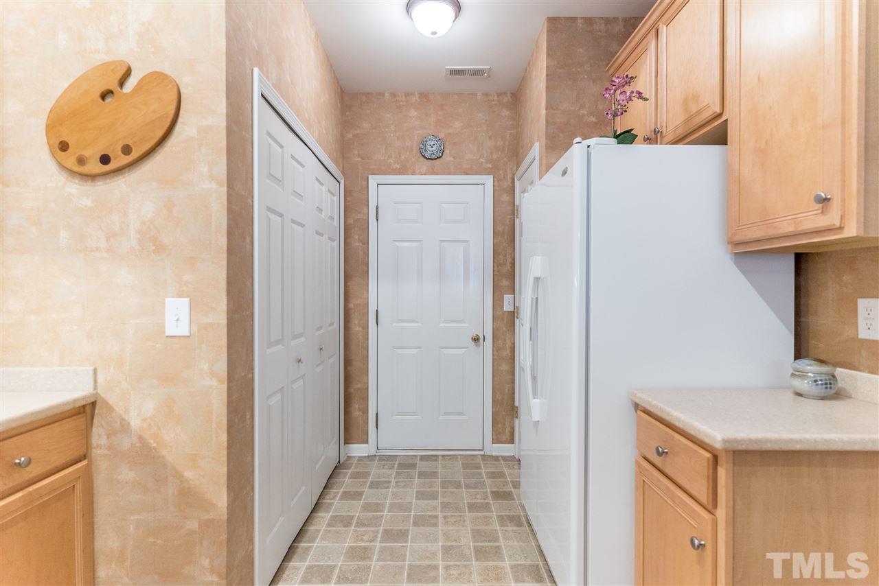 10423 Dapping Drive Raleigh, NC 27614 - Photo 6 of 25 a bathroom with a sink a mirror and a shower