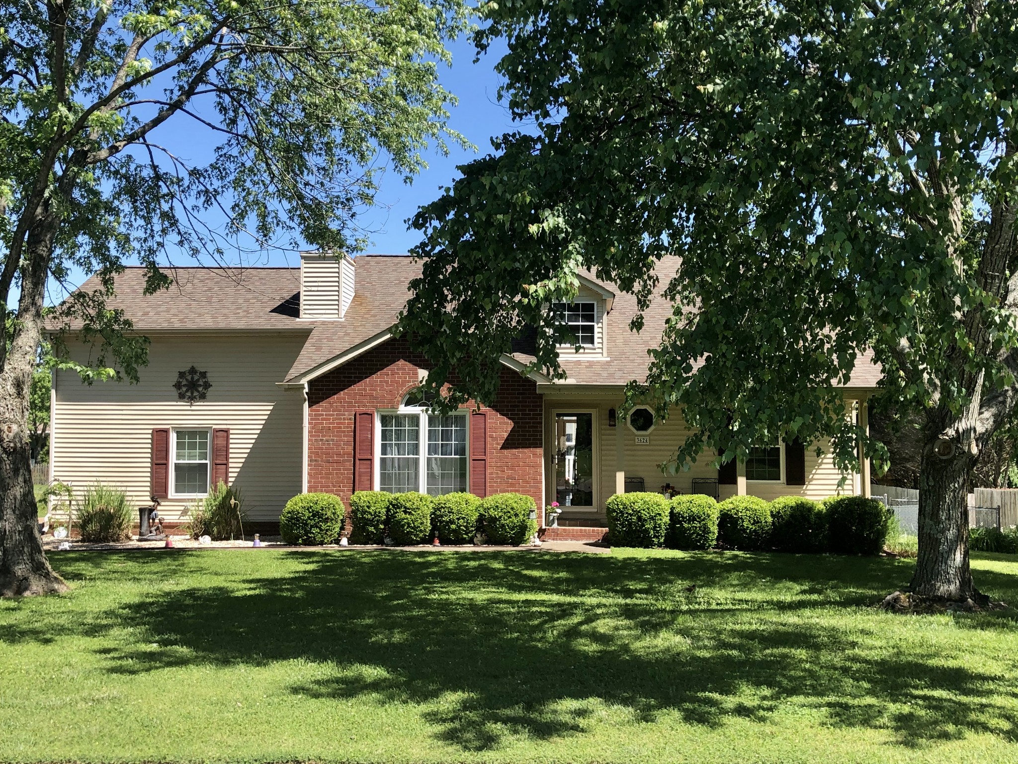 3624 Rutherford Drive Spring Hill, TN 37174 - Photo 1 of 33 a front view of a house with a garden