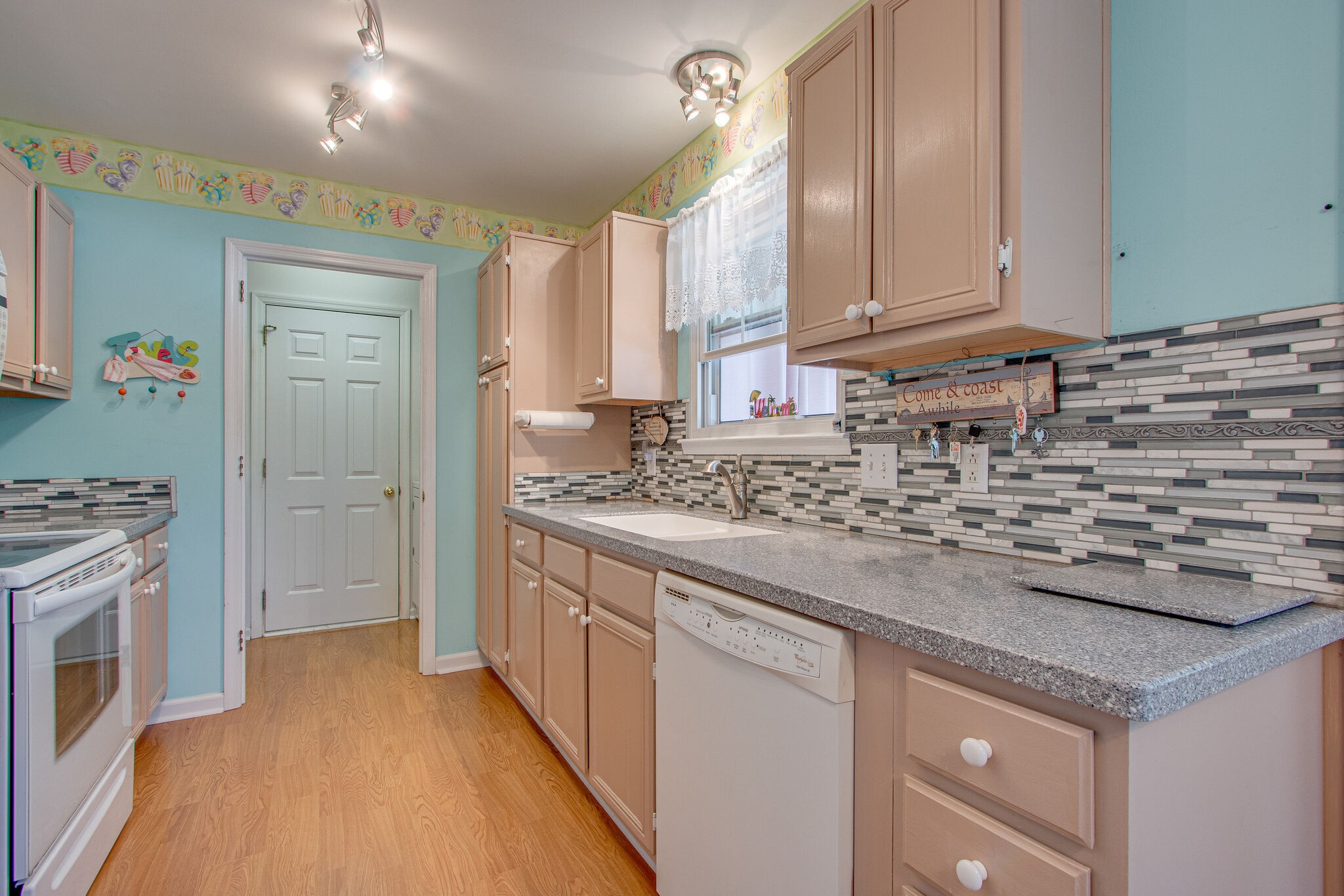 3624 Rutherford Drive Spring Hill, TN 37174 - Photo 11 of 33 a kitchen with stainless steel appliances granite countertop a sink and a stove