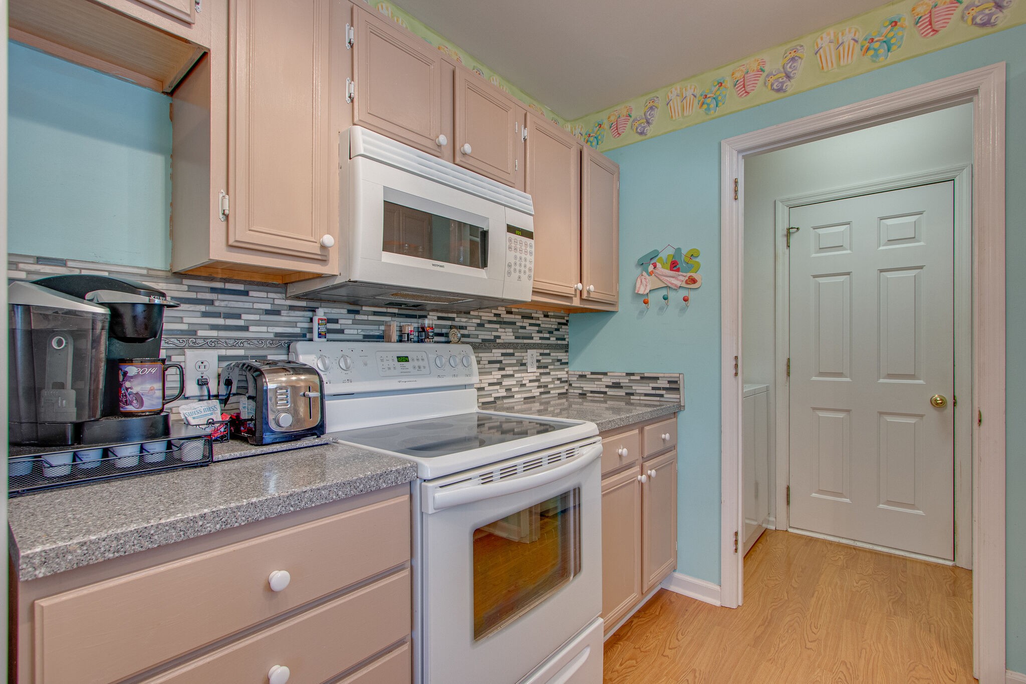 3624 Rutherford Drive Spring Hill, TN 37174 - Photo 12 of 33 a kitchen with stainless steel appliances granite countertop a stove and a microwave