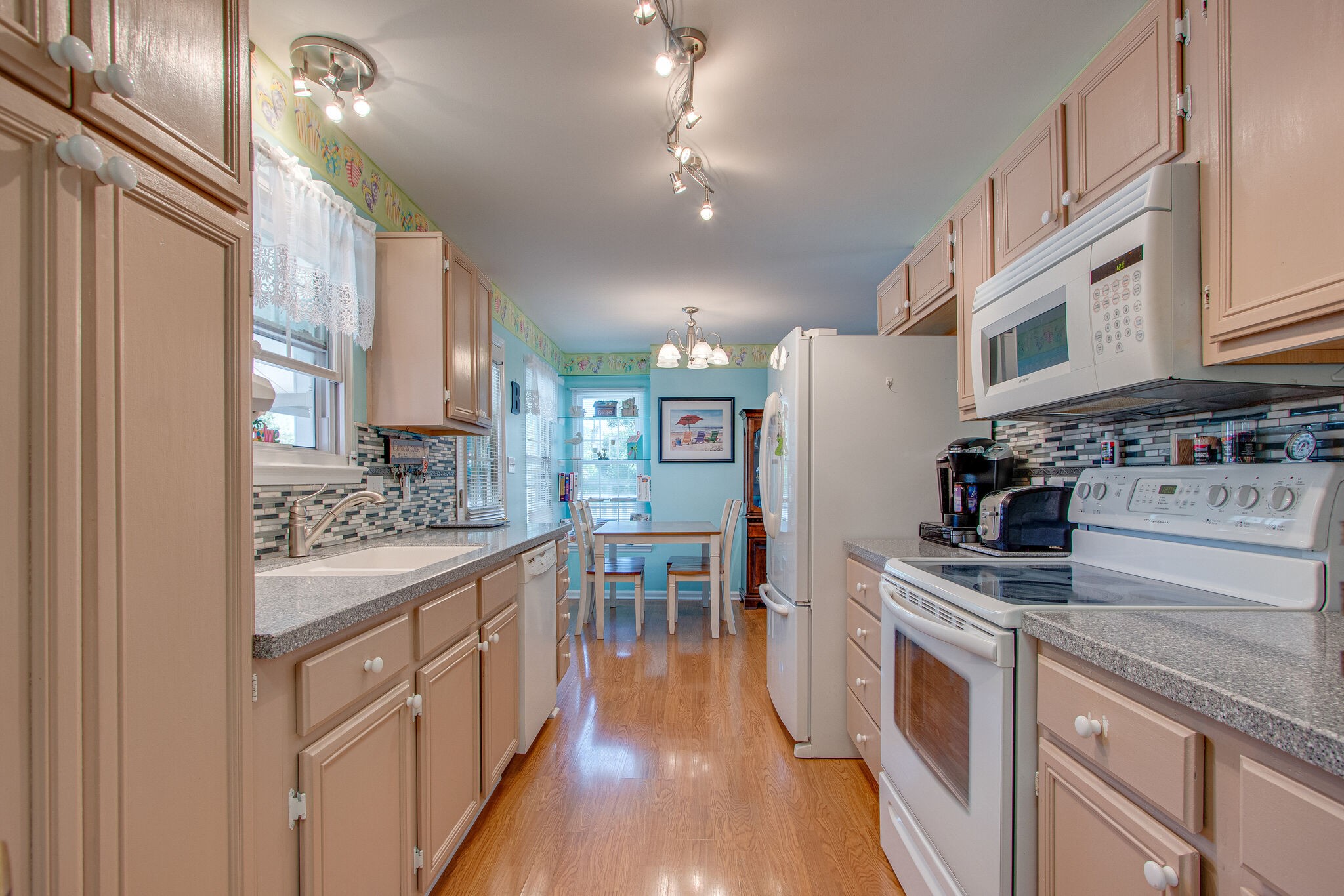 3624 Rutherford Drive Spring Hill, TN 37174 - Photo 13 of 33 a kitchen with stainless steel appliances granite countertop a stove and a wooden floors