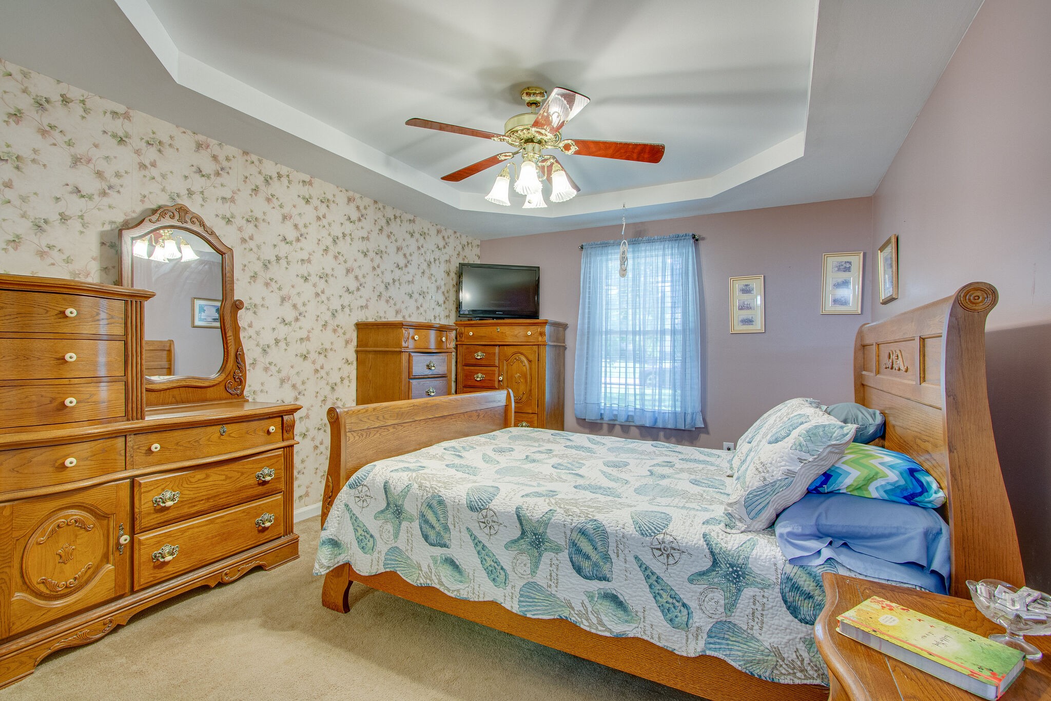 3624 Rutherford Drive Spring Hill, TN 37174 - Photo 15 of 33 a bedroom with a bed and a chandelier