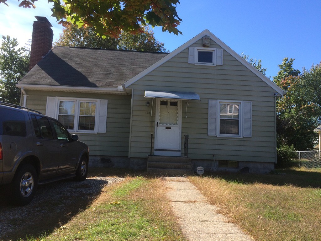162 Allen Street Springfield, MA 01108 - Photo 1 of 19 a front view of a house with a yard
