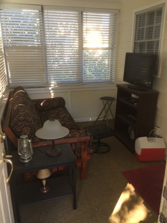 162 Allen Street Springfield, MA 01108 - Photo 16 of 19 a room with furniture and a window