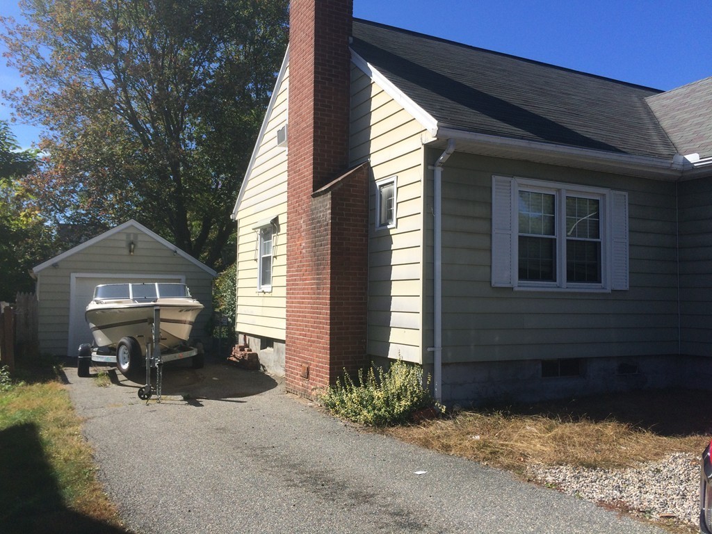 162 Allen Street Springfield, MA 01108 - Photo 2 of 19 a front view of a house with a yard