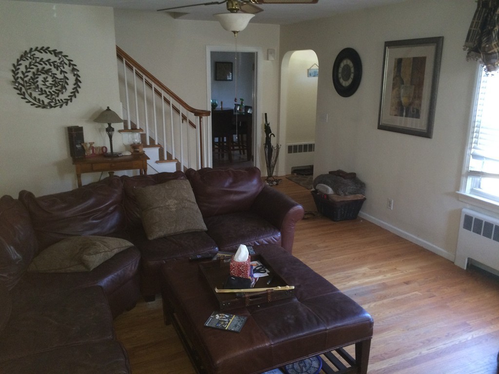 162 Allen Street Springfield, MA 01108 - Photo 4 of 19 a living room with furniture and a chandelier