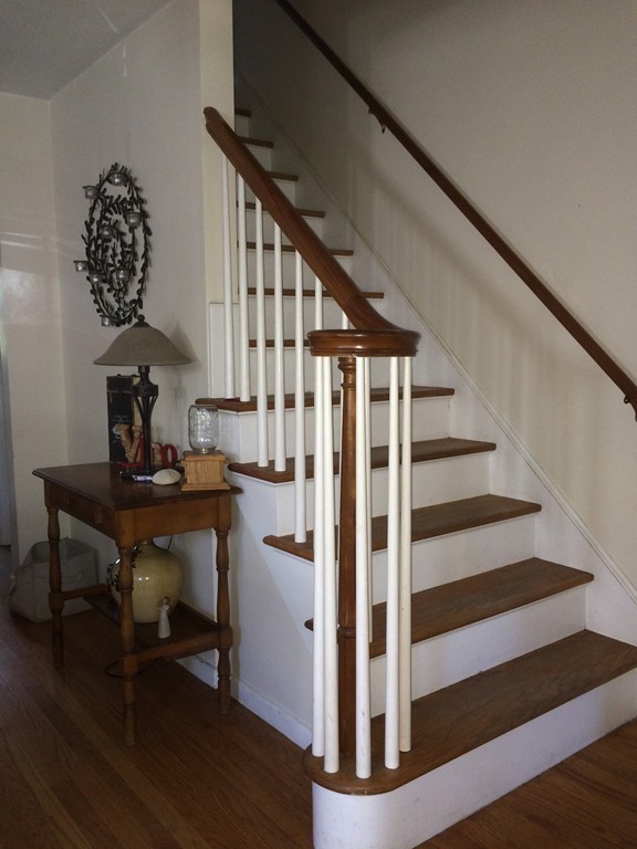 162 Allen Street Springfield, MA 01108 - Photo 5 of 19 a view of entryway with wooden floor and stairs