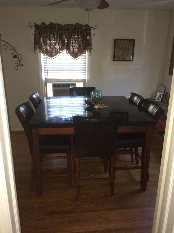 162 Allen Street Springfield, MA 01108 - Photo 7 of 19 a view of a workspace room with furniture and a window