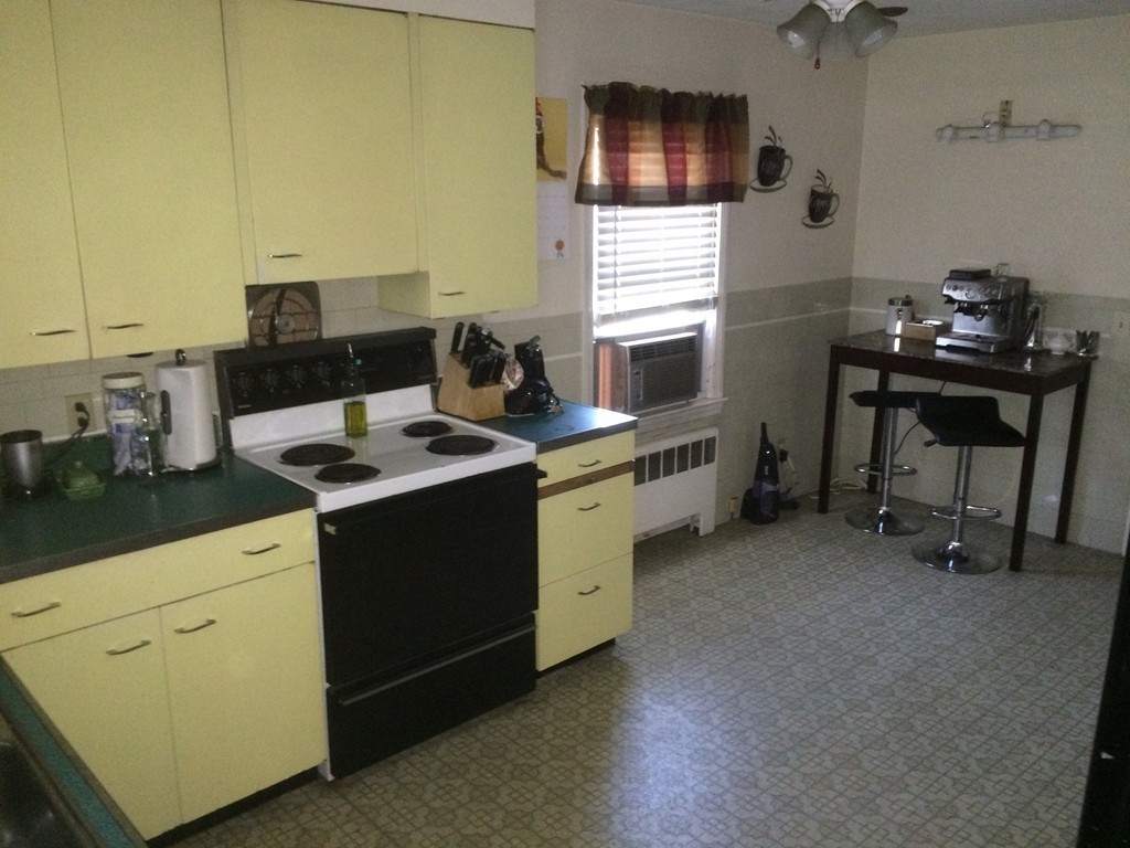 162 Allen Street Springfield, MA 01108 - Photo 10 of 19 a kitchen that has a sink and a stove