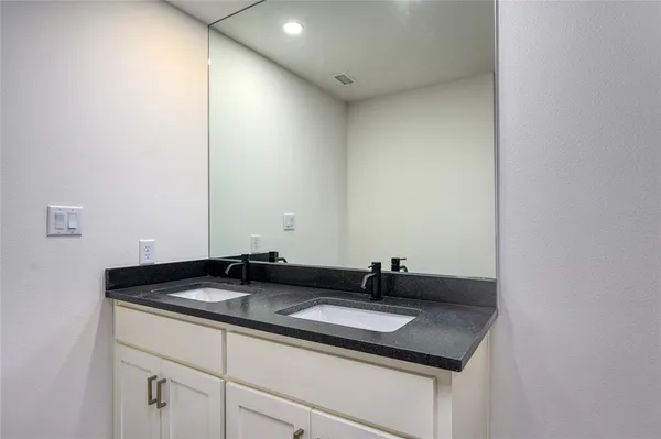 a bathroom with a shower and a toilet