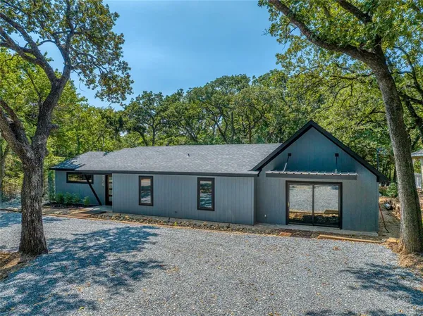 a house with trees in the background