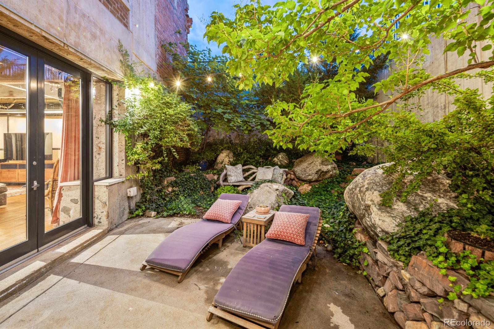 2000 Little Raven Street, Unit 1B Denver, CO 80202 - Photo 33 of 39 a view of a backyard with sitting area