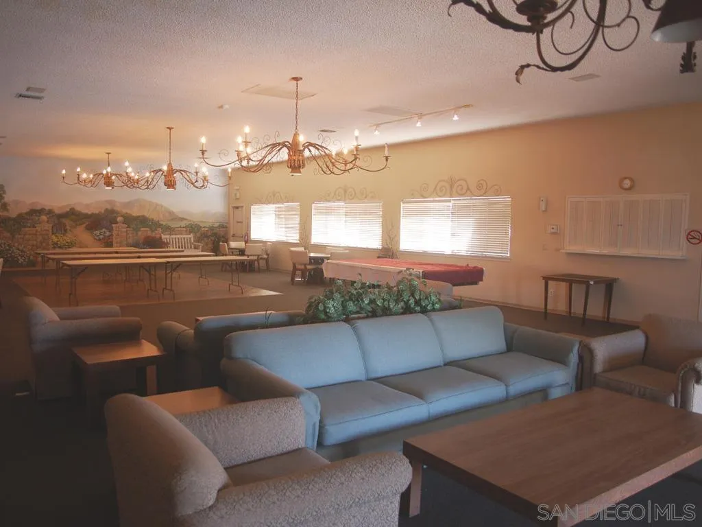13300 East Los Coches Road East, Unit 68 El Cajon, CA 92021 - Photo 12 of 26 a living room with furniture and a large window