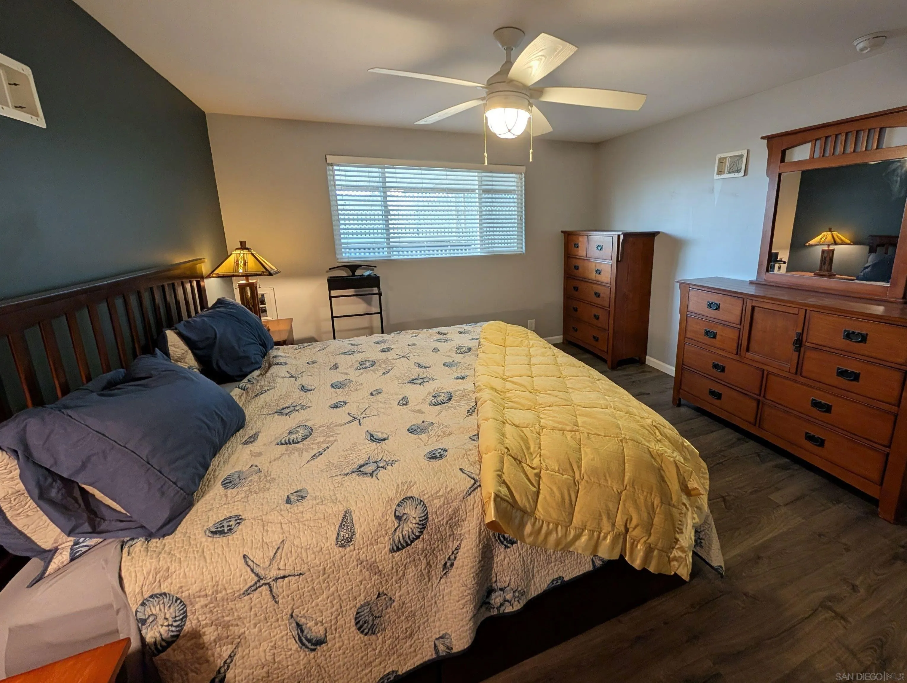 13300 East Los Coches Road East, Unit 68 El Cajon, CA 92021 - Photo 17 of 26 a bedroom with a bed and wooden floor