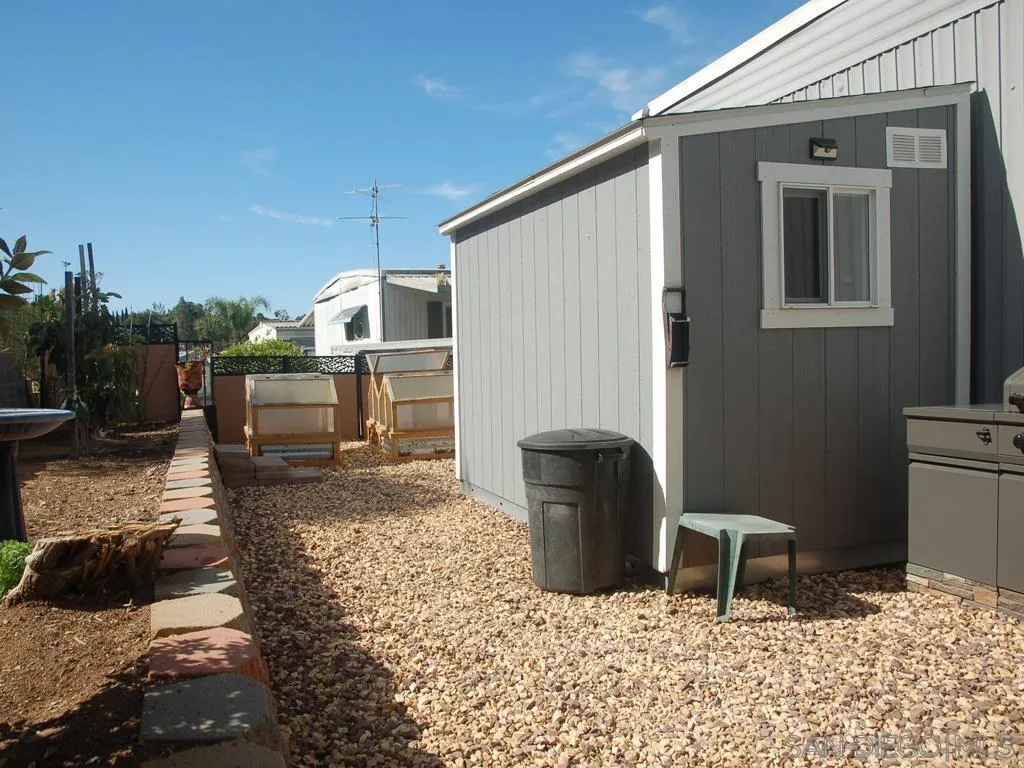 13300 East Los Coches Road East, Unit 68 El Cajon, CA 92021 - Photo 8 of 26 a backyard of a house with yard fire pit and outdoor seating