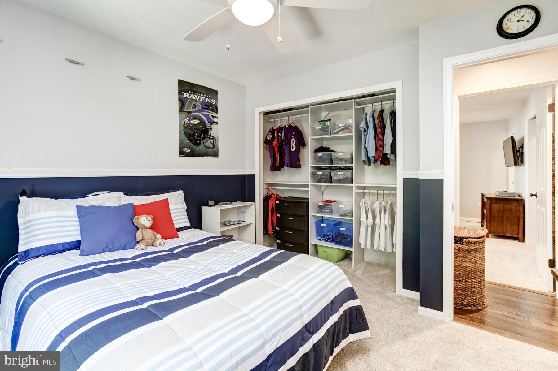 307 Saddle Ridge Road Annapolis, MD 21403 - Photo 25 of 46 a bedroom with a large bed and a wooden floor