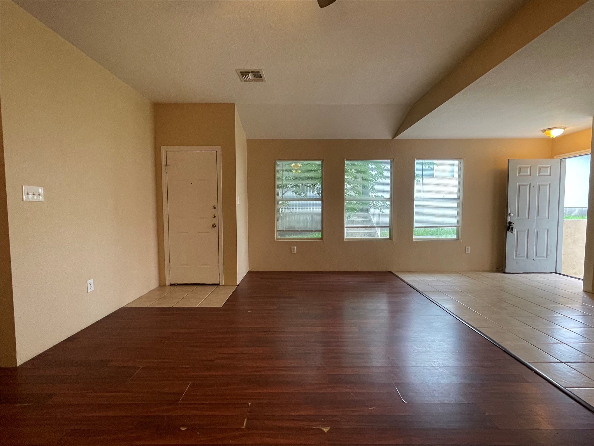 11241 Terra Loop Road San Antonio, TX 78233 - Photo 5 of 5 A welcoming entry area with rich wood and neutral tile flooring provides a clear transition into the main living space.