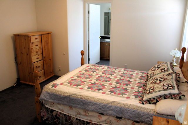 22580 Spring Creek Drive, Unit B61 Fairview, UT 84629 - Photo 21 of 39 Room featuring neutral wall tones and dark carpeting