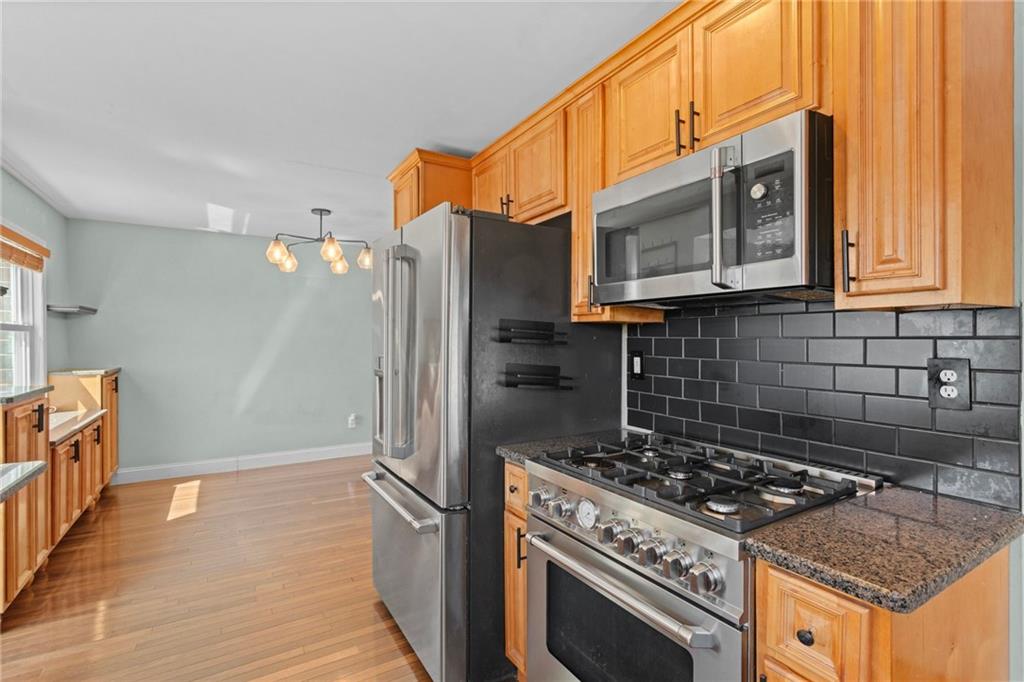 351 Engle Road Industry, PA 15052 - Photo 14 of 50 a kitchen with granite countertop a stove and a refrigerator