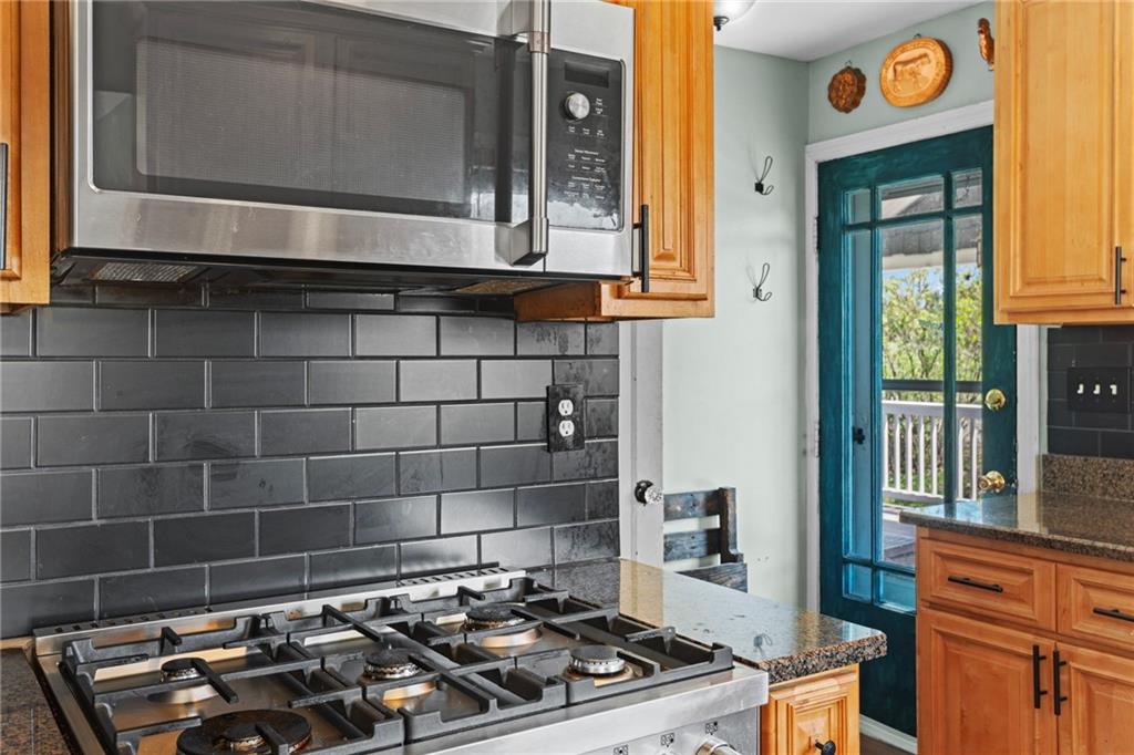 351 Engle Road Industry, PA 15052 - Photo 15 of 50 a kitchen with a stove and a microwave